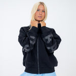 The Oversized Zip-Up in Black by Barre Trash